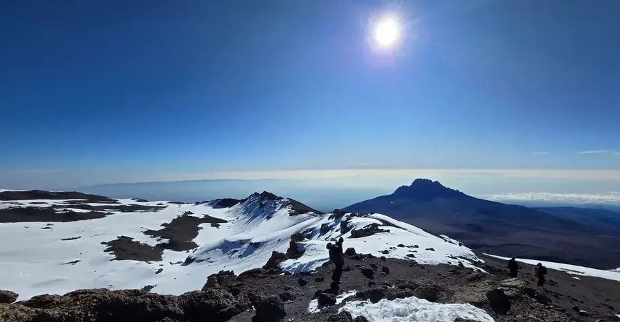 A clear day at the summit of Kilimanjaro with a view overlooking the expanse.